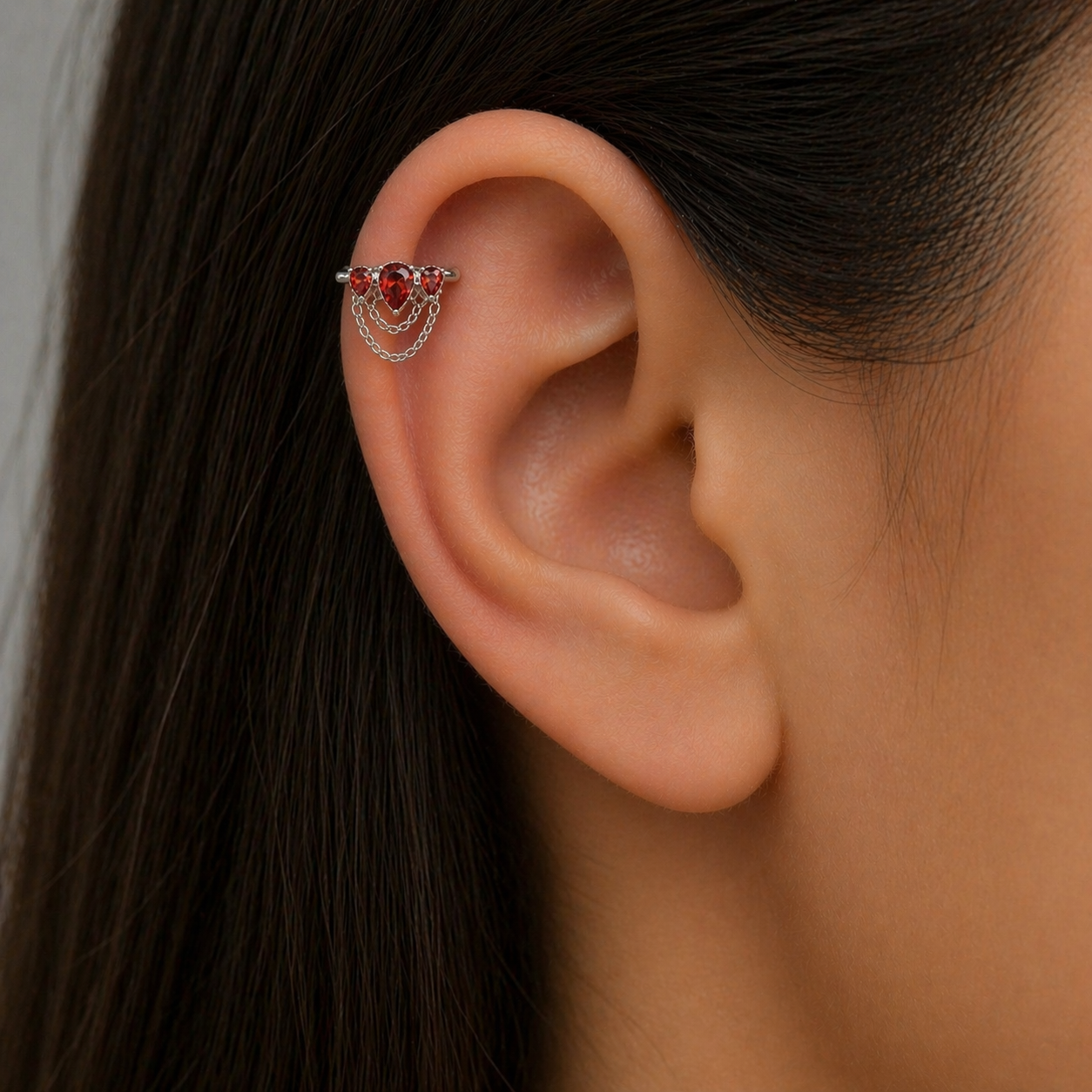 Piercing Cerchio in acciaio con cristalli rossi e catene